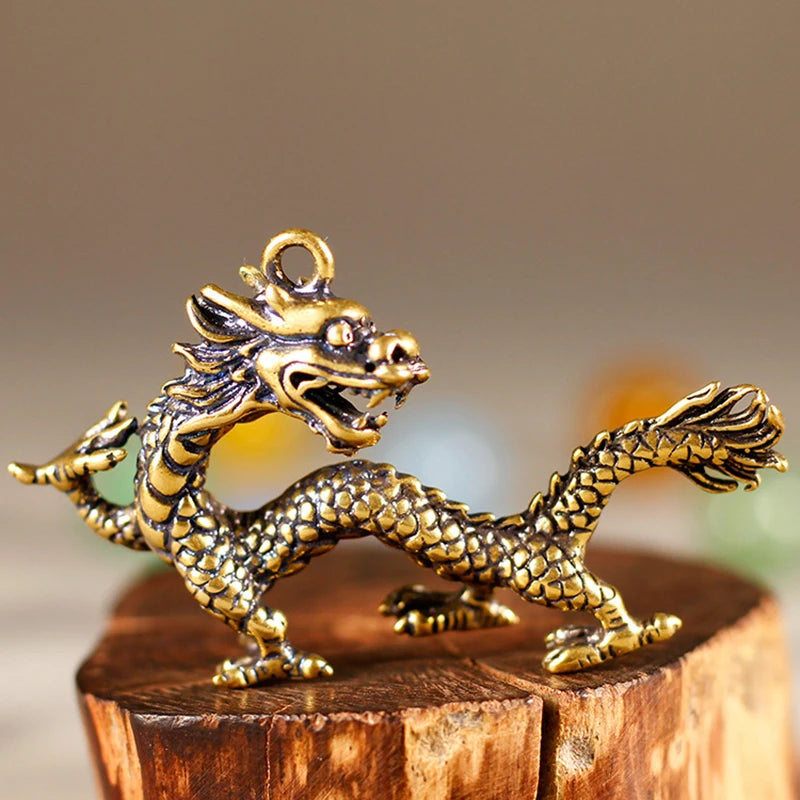 pendantin dragon doré écailles cuivre artisanal anneau inclusionOpaque ancien maison