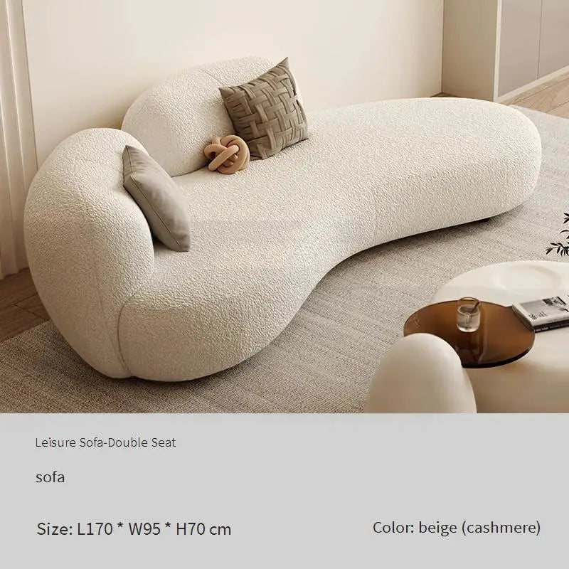 canapé lit blanc bouclé moderne table basse coussins décoratifs