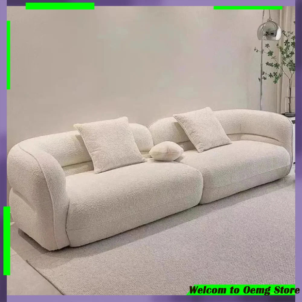 canapé moderne vert olive beige clair tissu bouclé confortable pieds ronds coussins décoratifs forme