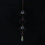 bijou pendentif cristal or bleu violet vert formes géométriques motifs oculaires translucides boho chic
