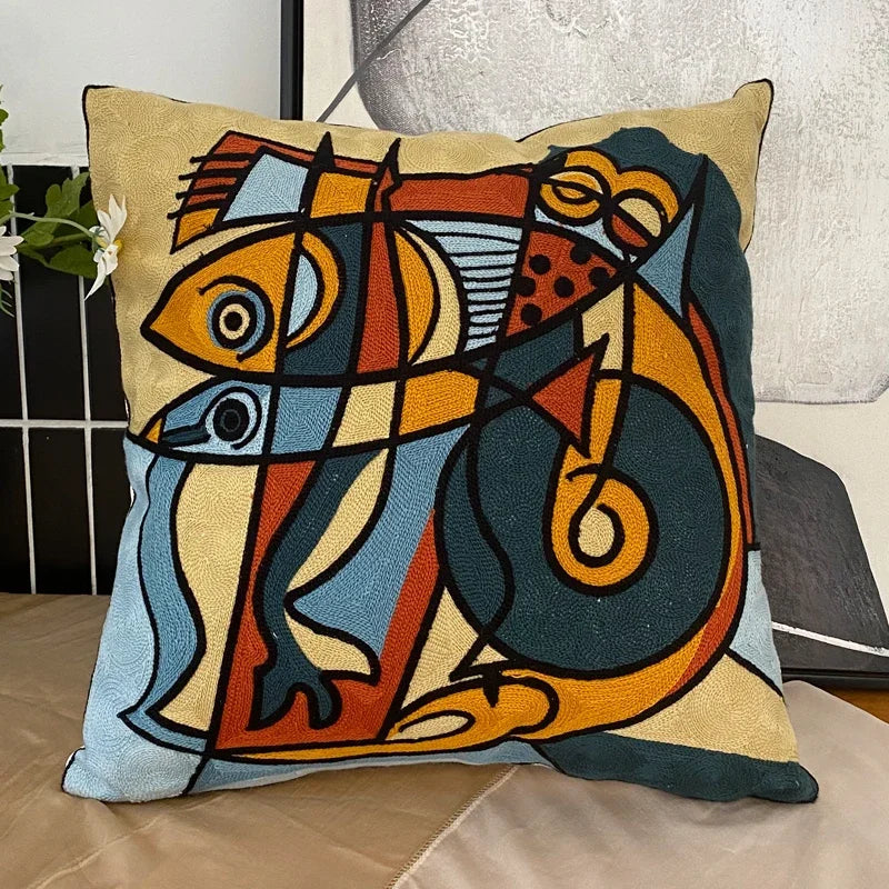 housse coussin coton brodé motifs abstraits visages stylisés moderne pop art bleu blanc orange