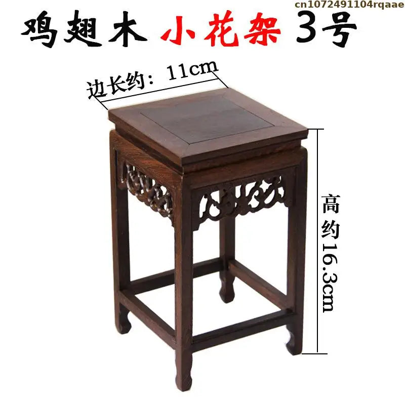 table bois foncée traditionnel gravures décoratives décoration vintage exposant figurines vases bonsaïs