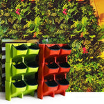 Système jardinage vertical moderne pots différentes tailles plantes fleurs mur orange vert jaune