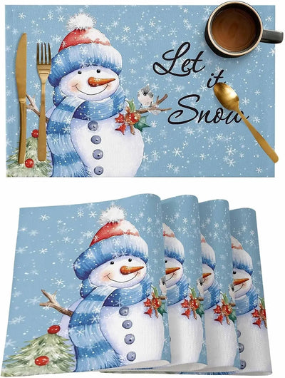 Set de table Noël bleu avec motif bonhomme de neige sur table en bois