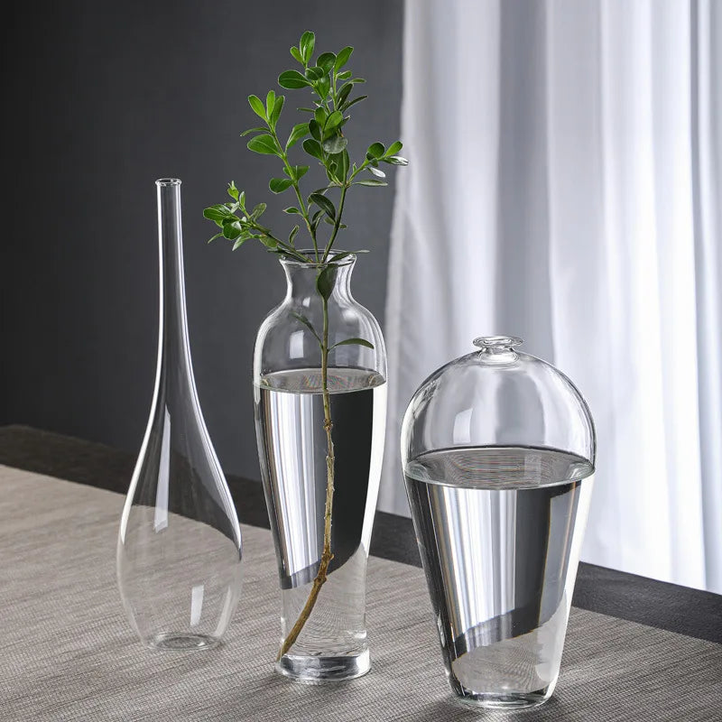 vases verre transparent modernes élégants branches feuilles roses arrangements floraux table maison mariage