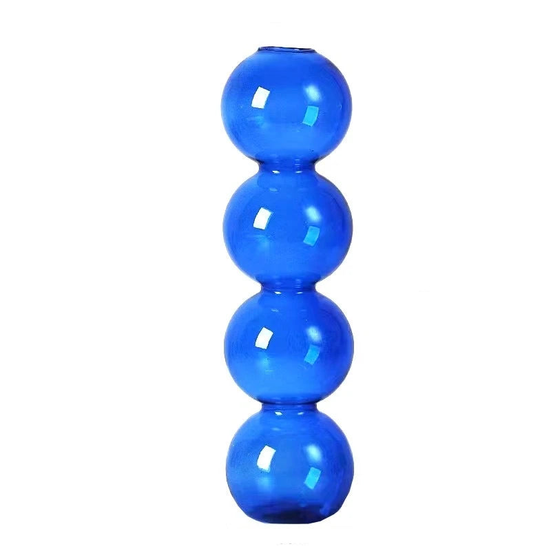vases transparents modernes sphères empilées bleu vert marron beige