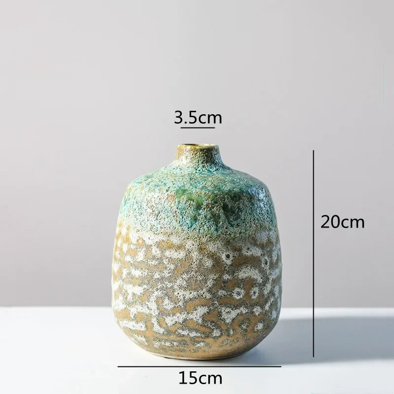 vase céramique rustique vert beige marron texturé variations couleur branches feuilles arrangement floral