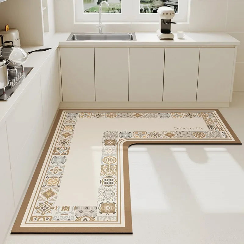 Carrelage au sol de style vintage avec un motif décoratif et des couleurs neutres dans une cuisine moderne et épurée.