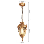 lampe suspendue vintage bronze noir ornements sculptés verre texturé semi opaque chambre salon