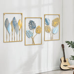 décoration murale métal feuilles stylisées bleu doré jaune art moderne salon maison intérieur