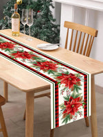 Élégant chemin de table de Noël avec des poinsettias rouges et des branches de sapin sur fond de carreaux noirs et rouges, accompagné d'une bouteille de vin et de verres de champagne sur une table en bois clair.
