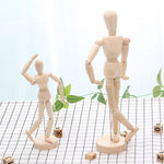 mannequins articulés bois classiques tailles diverses naturel clair base circulaire minimalistes adultes