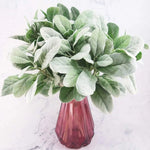 bouquet artificiel feuilles ovales vert clair gris rustique naturel vase transparent emballage brun serviette