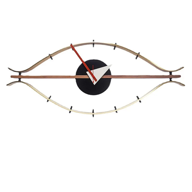 horloge murale forme œil moderne or marron foncé aiguilles rouge blanche minimaliste