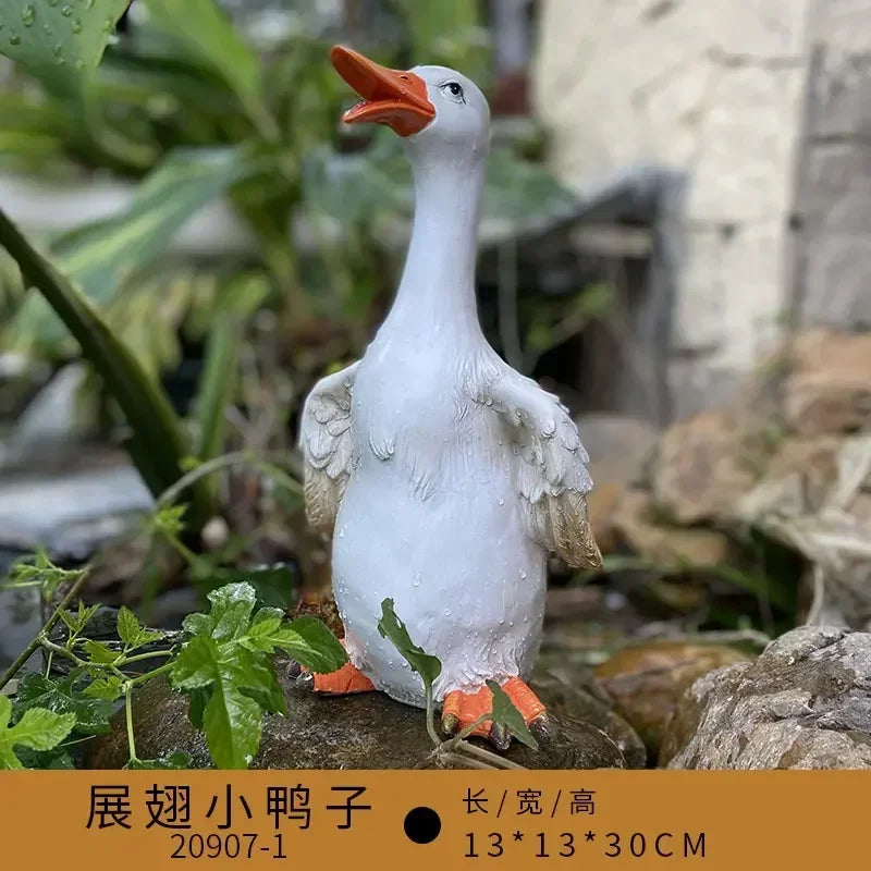 statue canard blanc plumes orange piscine jardin décoration extérieure animaux ornements paysagistes fleurs artificielles
