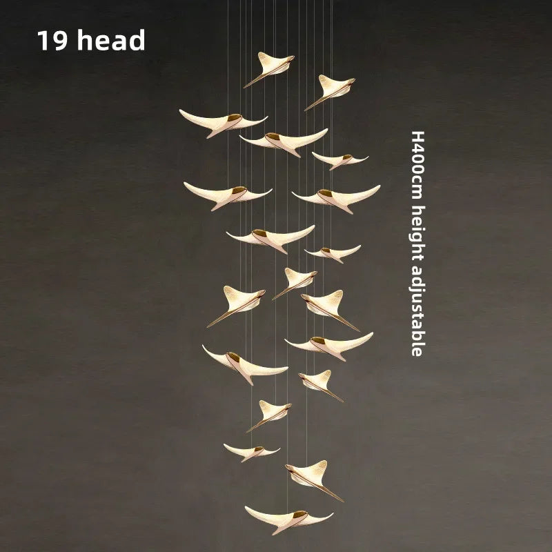 suspension lumineuse or oiseaux stylisés contemporaine minimaliste salon chaînes fixations métal lumière blanche chambre