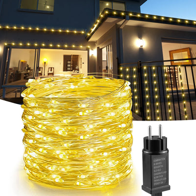 Guirlande lumineuse extérieure 50 m LED illuminant un jardin de nuit