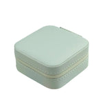 boîte bijoux simili cuir vert pastel moderne fermeture glissière blanc rose pâle boucles doreilles