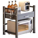 rangement cuisine tiroirs acier inoxydable gris noir moderne batteur cuillères couteaux toaster friteuse