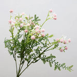décoration intérieure bouquet artificiel feuilles vertes fleurs blanches jaunes roses naturel salon jardin