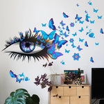 sticker mural moderne oeil stylisé papillons fleurs bleu rose violet noir chambre coucher