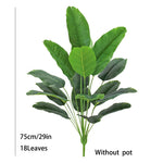 plantes artificielles vertes feuilles larges moderne decoration intérieure feuilles nervures perforations racines apparentes minimaliste