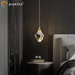 suspension lumineuse moderne transparente facettes géométriques dorées élégante autoinstallation led chambre salon