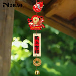 décorations nouvelles années cloches vent rouges dorées blanches oiseaux monnaies caractères chinois traditionnelles
