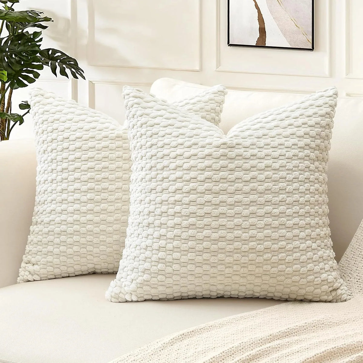 coussin décoratif beige vert foncé motif géométrique pompons moderne canapé salon maison