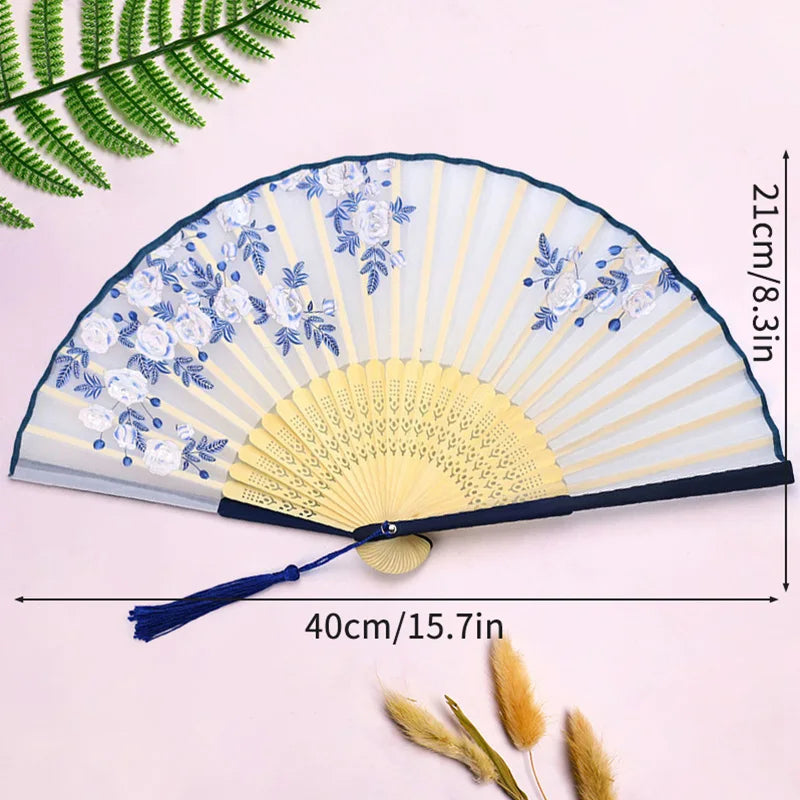 éventail pliant traditionnel bambou motif fleurs cerisier pompon mariage élégant