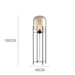 lampe sol moderne transparente ampoule filament noir gris fumé led verre minimaliste