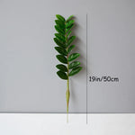 plantes artificielles branches vertes feuilles simples extérieur moderne pot blanc exposé