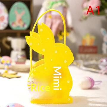sac main forme lapin fleurs blanches taches noires couleurs vert rose bleu jaune pâques