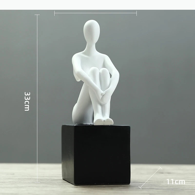 statues décoratives minimalistes figures humaines stylisées blanc noir élément doré moderne abstrait