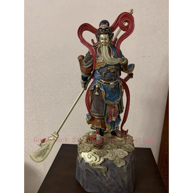 statue personnage masculin armure bâton socle rocheux motifs complexes couleurs or rouge bleuTextures variées