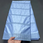 tissu brodé vert clair beige bleu coton opacité résistance brocart dobby haute qualité