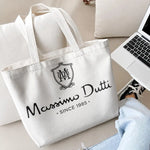 sac main toile blanche pochette logo poignées détachables fermeture éclair