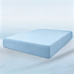 parure lit bleu clair drap housse élastique deux oreillers coton doux chambre moderne