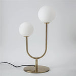 lampe table moderne or blanc sphères translucides câble noir base plate