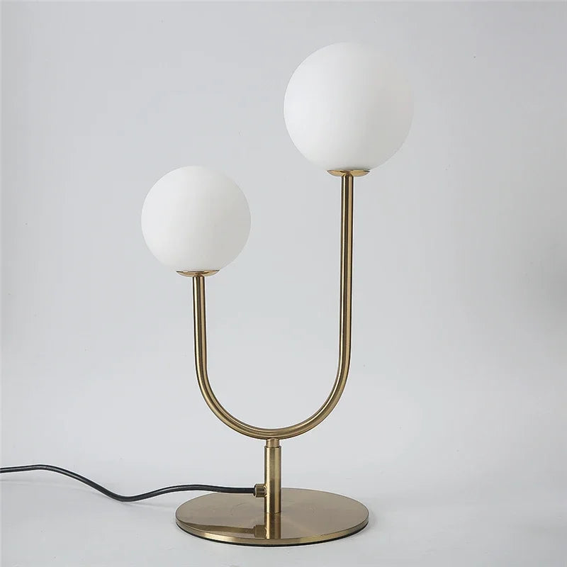lampe table moderne or blanc sphères translucides câble noir base plate