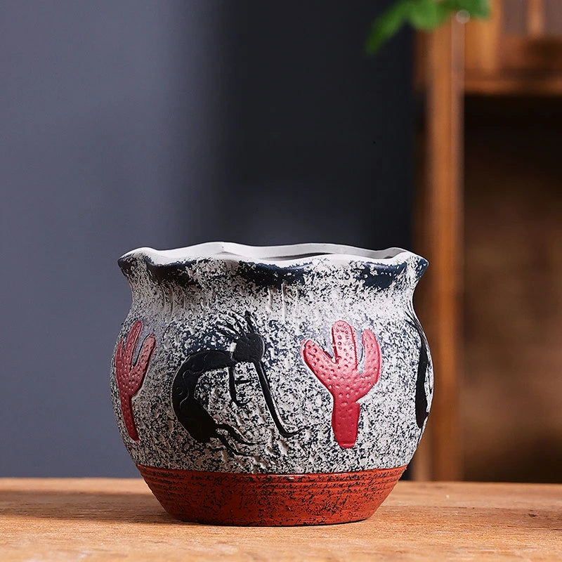 cache pot céramique artisanal méditerranéen couleurs vives motifs texturés plante verte intérieur moderne