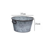 seau métal vintage anses rouille plante verte fleur blanche pot terre cuite brique rouge