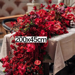 décoration événement mariage anniversaire rose anthuriums dahlia feuillage dense nappe tissu