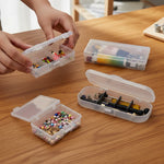 boîtes rangement transparentes clips bijoux multicolores pièces métalliques modernes respectueux environnement