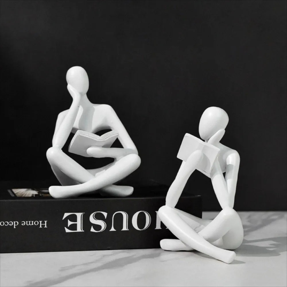 figurine deco moderne or noir blanc personne assise livre socle chambre abstraction minimalisme