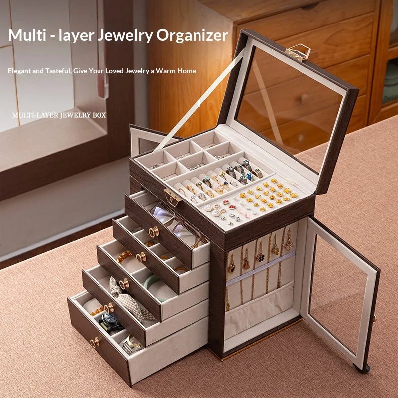 boîte bijoux multi niveaux marron foncé grain bois verre transparent poignées dorées élégante rangement