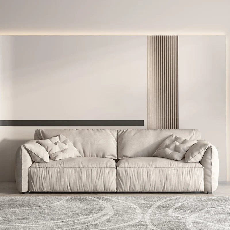 canapé salon contemporain beige doux coussins minimaliste moderne fixations pieds