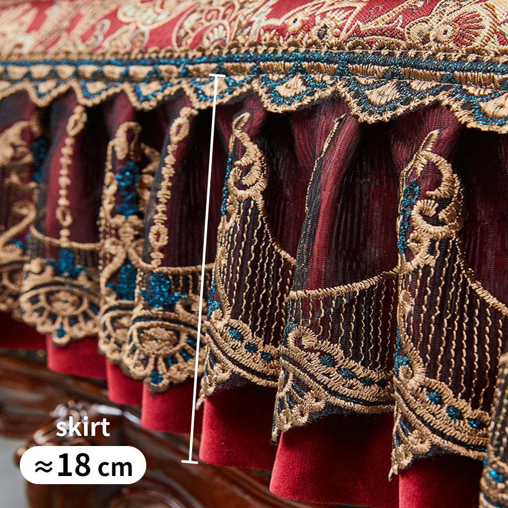 Une jupe ornée de magnifiques motifs floraux et de broderies dorées sur un fond rouge foncé, avec des détails bleus qui ajoutent de la profondeur et de la richesse à ce vêtement traditionnel.