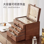 coffret bijoux bois marron tiroirs poignées dorées rangement moderne minimaliste