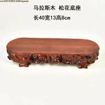 support bonsaï bois sculpté motifs floraux artisanal marron foncé unique présentation plante fleur